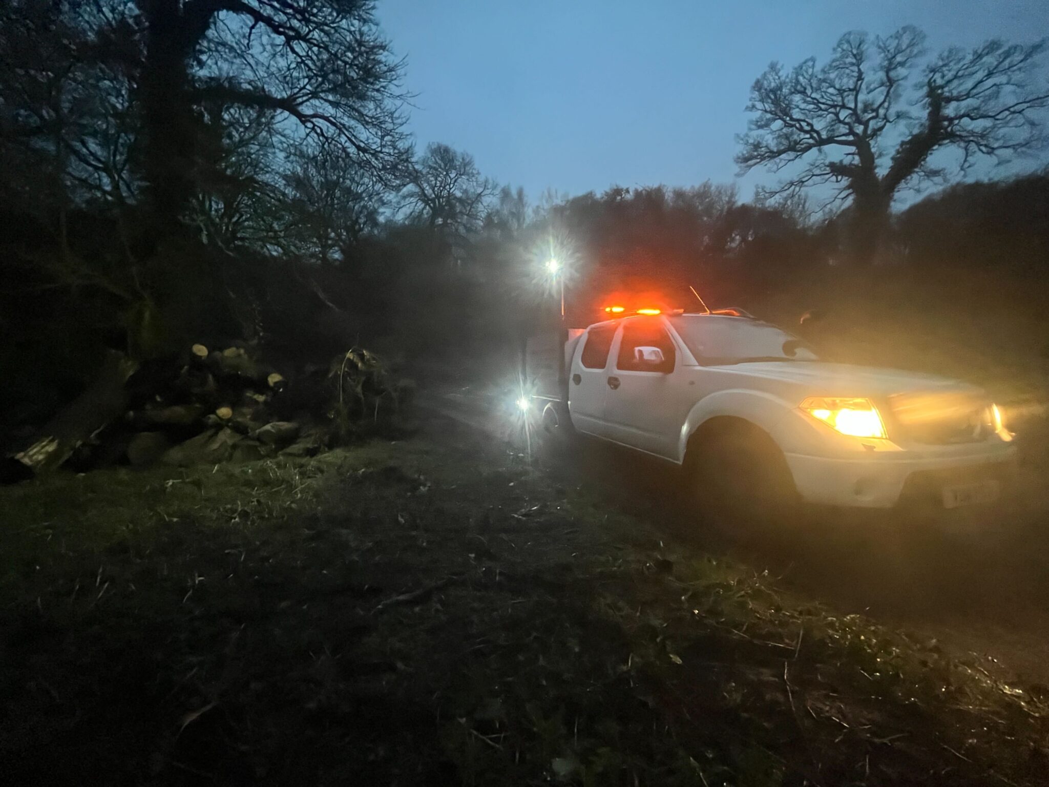 The Clearcut pickup with beacons flashing at a night-time call-out