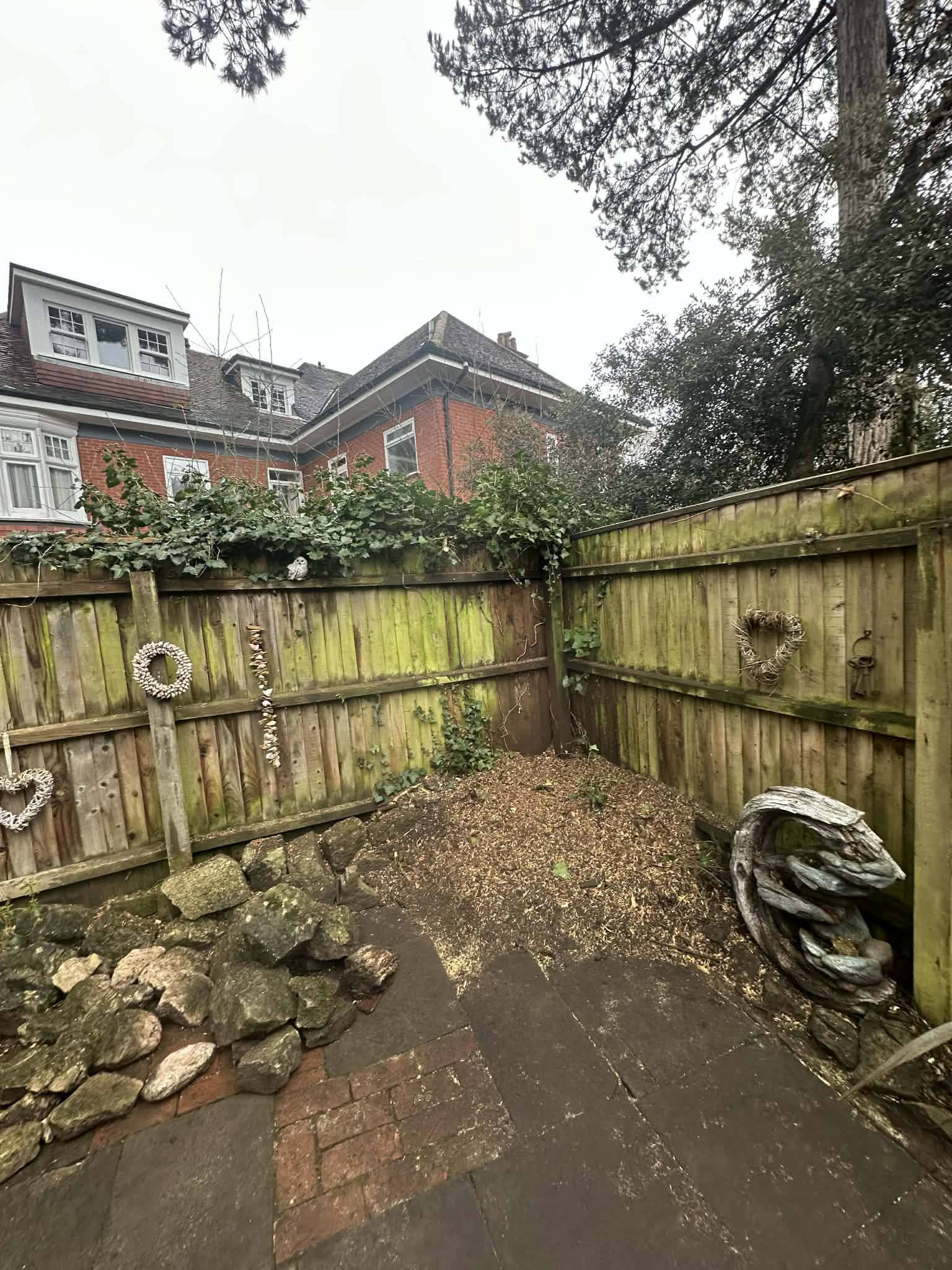 Tree surgeon carrying out stump grinding work